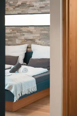 Ein Bett oder Betten in einem Zimmer der Unterkunft Ferienwohnung Wilder Kaiser