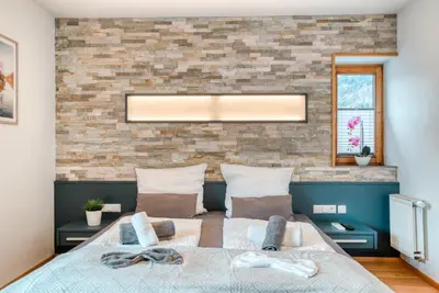 Ein Bett oder Betten in einem Zimmer der Unterkunft Ferienwohnung Wilder Kaiser