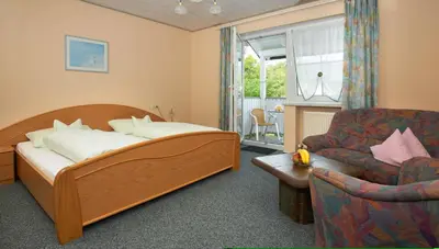 Ein Bett oder Betten in einem Zimmer der Unterkunft Pension Martinus