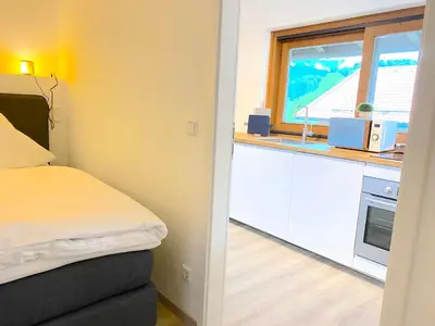 Ein Bett oder Betten in einem Zimmer der Unterkunft Großzügige Ferienwohnung am Tegernsee mit Südbalkon und Wallbergblick