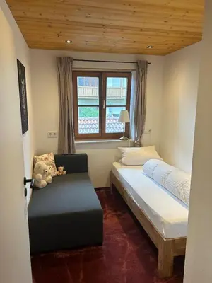 Ein Bett oder Betten in einem Zimmer der Unterkunft Ferienwohnung Räsl