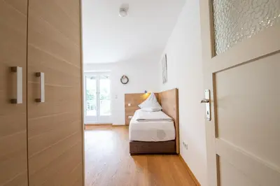Ein Bett oder Betten in einem Zimmer der Unterkunft Ludwigschlössl