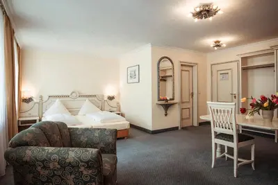 Ein Bett oder Betten in einem Zimmer der Unterkunft Hotel Limmerhof