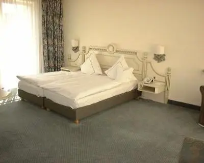 Ein Bett oder Betten in einem Zimmer der Unterkunft Hotel Limmerhof