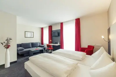 Ein Bett oder Betten in einem Zimmer der Unterkunft Altstadthotel Kneitinger, Abensberg