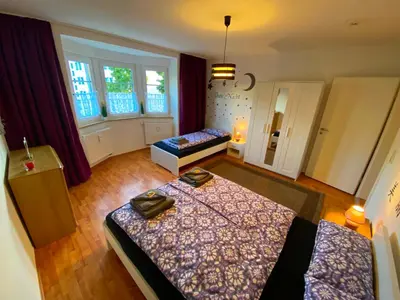 Ein Bett oder Betten in einem Zimmer der Unterkunft Ferienwohnung Augsburg 1