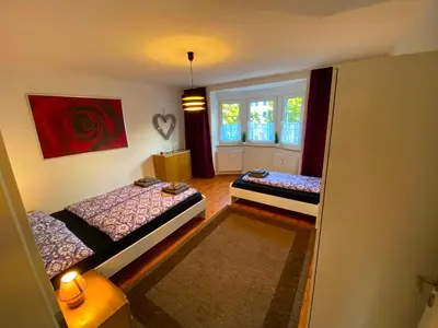 Ein Bett oder Betten in einem Zimmer der Unterkunft Ferienwohnung Augsburg 1