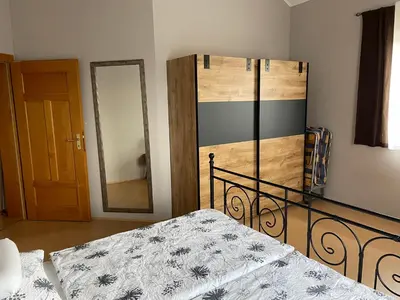 Ein Bett oder Betten in einem Zimmer der Unterkunft TopLoft im Ilmtal
