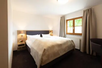 Ein Bett oder Betten in einem Zimmer der Unterkunft Hotel Haflhof