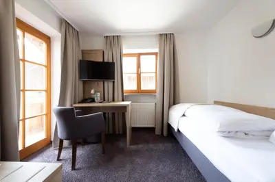 Ein Bett oder Betten in einem Zimmer der Unterkunft Hotel Haflhof