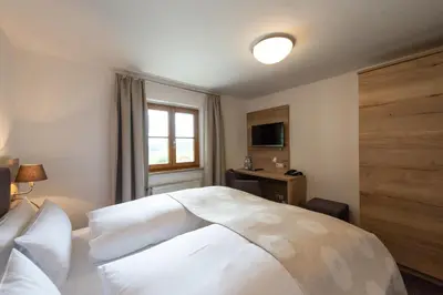 Ein Bett oder Betten in einem Zimmer der Unterkunft Hotel Haflhof