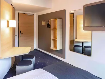 Ein Bett oder Betten in einem Zimmer der Unterkunft B&B Hotel Augsburg-Nord