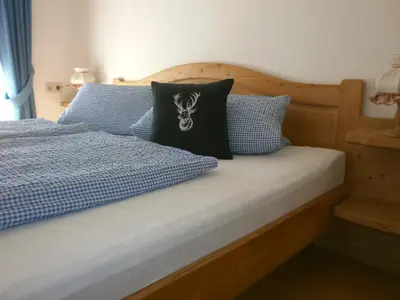 Ein Bett oder Betten in einem Zimmer der Unterkunft Alpenresidenz Chiemgau