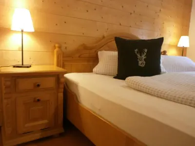 Ein Bett oder Betten in einem Zimmer der Unterkunft Alpenresidenz Chiemgau