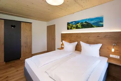 Ein Bett oder Betten in einem Zimmer der Unterkunft Niederauer Hof