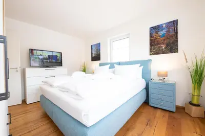 Ein Bett oder Betten in einem Zimmer der Unterkunft Alpenzauber