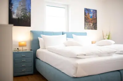 Ein Bett oder Betten in einem Zimmer der Unterkunft Alpenzauber