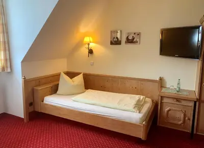 Ein Bett oder Betten in einem Zimmer der Unterkunft Gasthof Hartl Zum Unterwirt