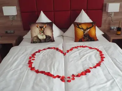 Ein Bett oder Betten in einem Zimmer der Unterkunft Hotel Isartaler Hof