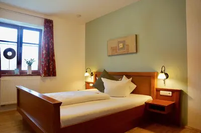 Ein Bett oder Betten in einem Zimmer der Unterkunft Pension Kramerhof