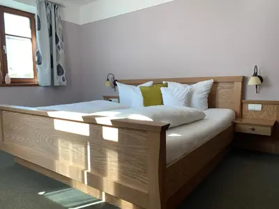 Ein Bett oder Betten in einem Zimmer der Unterkunft Pension Kramerhof