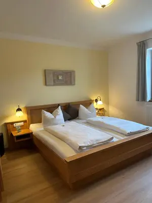 Ein Bett oder Betten in einem Zimmer der Unterkunft Pension Kramerhof