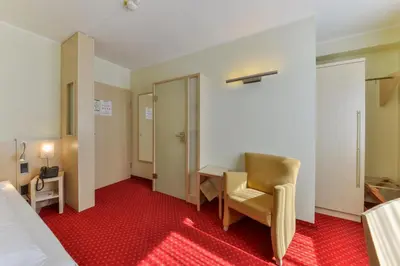 Ein Bett oder Betten in einem Zimmer der Unterkunft Hotel Schiller