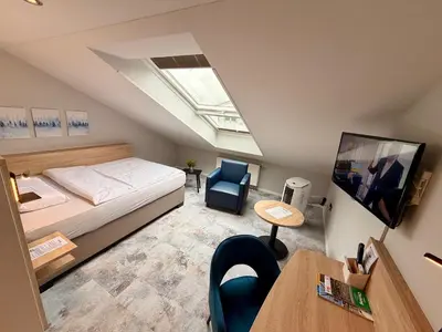 Ein Bett oder Betten in einem Zimmer der Unterkunft Hotel Schiller