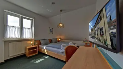Ein Bett oder Betten in einem Zimmer der Unterkunft Hotel Gasthof Lachner