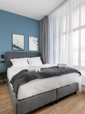 Ein Bett oder Betten in einem Zimmer der Unterkunft Limehome Augsburg Annastraße