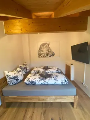 Ein Bett oder Betten in einem Zimmer der Unterkunft Ferienwohnung Lisl