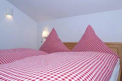 Ein Bett oder Betten in einem Zimmer der Unterkunft Ferienhaus Alpenflair bei Schliersee