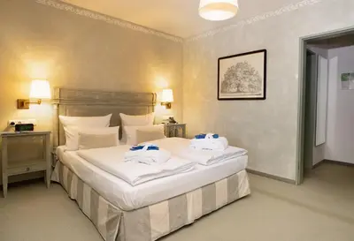 Ein Bett oder Betten in einem Zimmer der Unterkunft Marina Hotel am Starnberger See