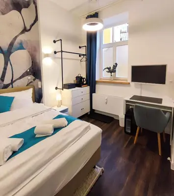 Ein Bett oder Betten in einem Zimmer der Unterkunft HOMELY STAY Studio 1 - Small and cozy Self-Check-In Room in Munich