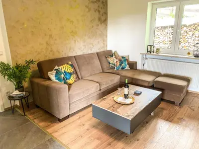 Ein Sitzbereich in der Unterkunft Ferienwohnung am Inn