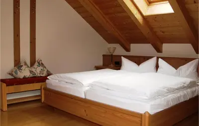 Ein Bett oder Betten in einem Zimmer der Unterkunft Amazing Apartment In Oberaudorf
