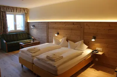 Ein Bett oder Betten in einem Zimmer der Unterkunft Hotel Bellevue