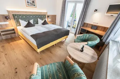 Ein Bett oder Betten in einem Zimmer der Unterkunft Hotel Bellevue