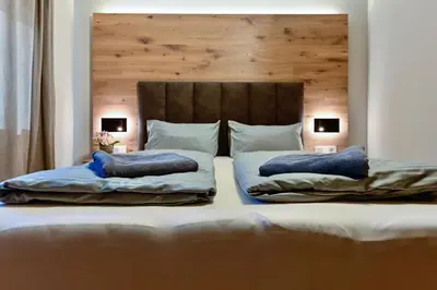Ein Bett oder Betten in einem Zimmer der Unterkunft Bergkind