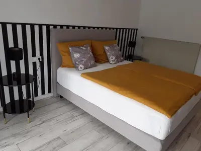 Ein Bett oder Betten in einem Zimmer der Unterkunft Apartment Kampenwand
