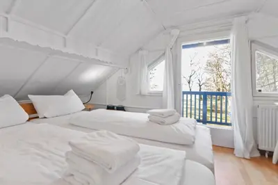 Ein Bett oder Betten in einem Zimmer der Unterkunft See-Chalet Riederau