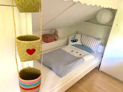 Ein Bett oder Betten in einem Zimmer der Unterkunft See-Chalet Riederau