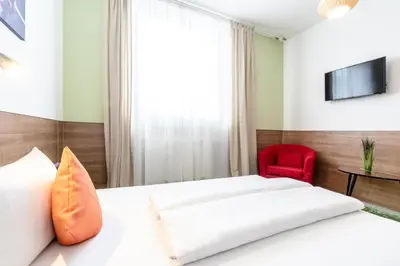 Ein Bett oder Betten in einem Zimmer der Unterkunft Apartimo Altdorf