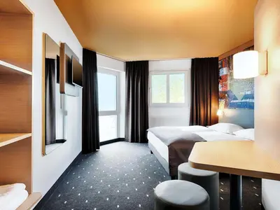 Ein Bett oder Betten in einem Zimmer der Unterkunft B&B Hotel München-Hbf