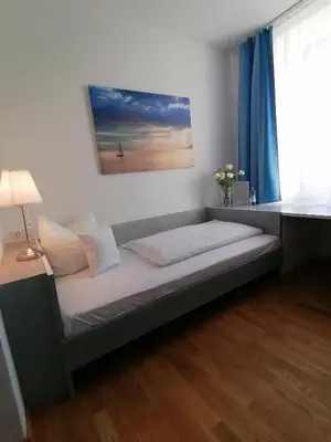 Ein Bett oder Betten in einem Zimmer der Unterkunft Hotel Wendelstein