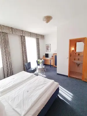 Ein Bett oder Betten in einem Zimmer der Unterkunft Hotel Wendelstein