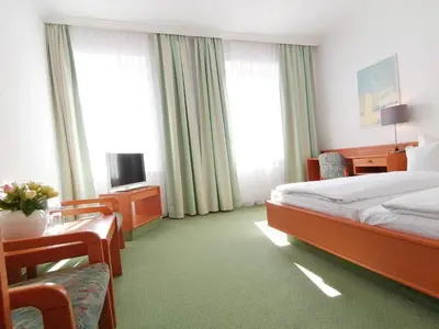 Ein Bett oder Betten in einem Zimmer der Unterkunft Hotel Wendelstein