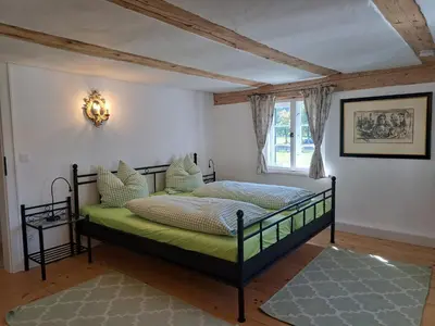 Ein Bett oder Betten in einem Zimmer der Unterkunft Neu! Ferienwohnungen im Lüftlmalereck, Hennalahaus