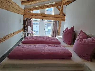 Ein Bett oder Betten in einem Zimmer der Unterkunft Neu! Ferienwohnungen im Lüftlmalereck, Hennalahaus