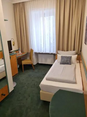 Ein Bett oder Betten in einem Zimmer der Unterkunft myMINGA4 - Hotel & serviced Apartments